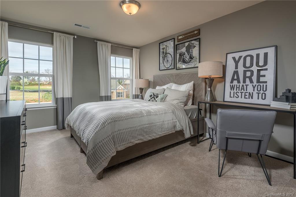 257 Keating Pl Drive, Unit 46 Fort Mill, SC 29708 - Photo 11 of 24 a bedroom with a bed and a window