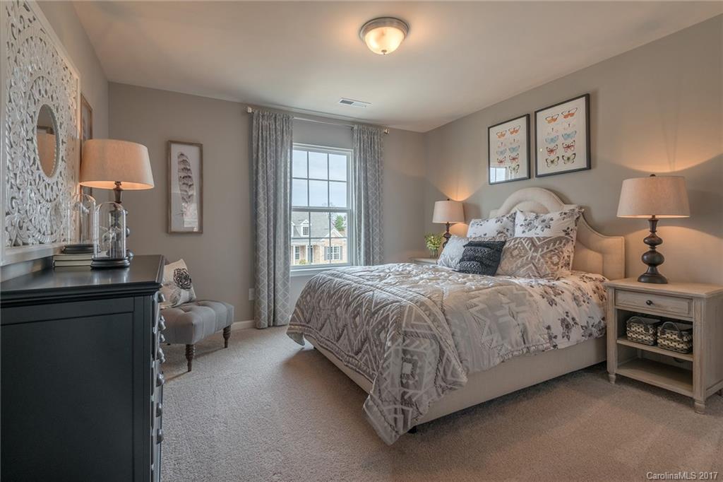 257 Keating Pl Drive, Unit 46 Fort Mill, SC 29708 - Photo 12 of 24 a bedroom with a bed and a window