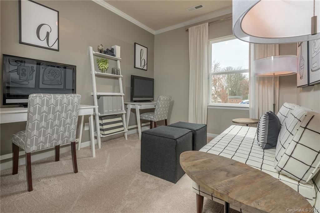 257 Keating Pl Drive, Unit 46 Fort Mill, SC 29708 - Photo 7 of 24 a living room with furniture and a flat screen tv