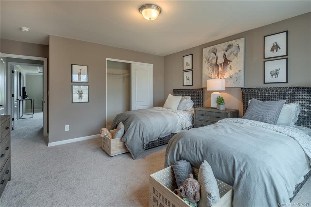 257 Keating Pl Drive, Unit 46 Fort Mill, SC 29708 - Photo 10 of 24 a bedroom with two beds and painting on the wall