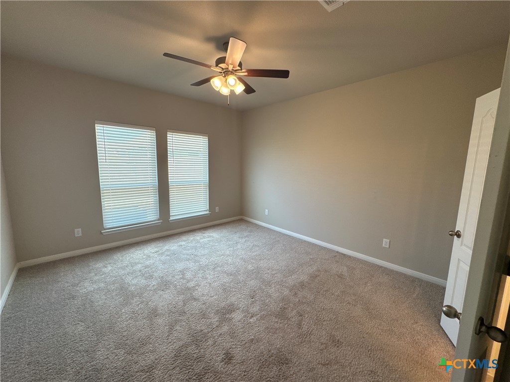 2214 Wasabi Road Temple, TX 76501 - Photo 12 of 26 a view of an empty room with a chandelier fan