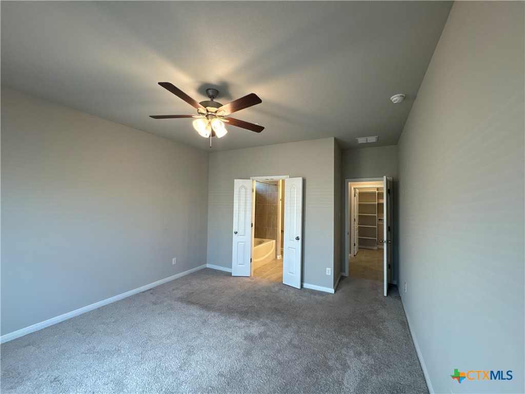 2214 Wasabi Road Temple, TX 76501 - Photo 16 of 26 an empty room and chandelier fan