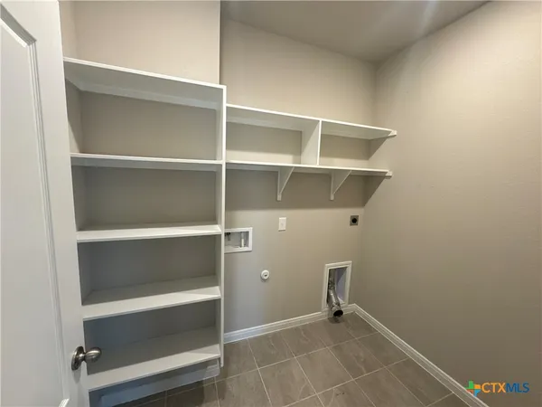 a view of an empty walk in closet
