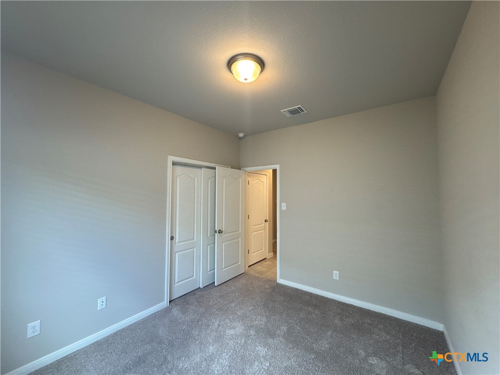 2214 Wasabi Road Temple, TX 76501 - Photo 19 of 26 an empty room with a space and a window