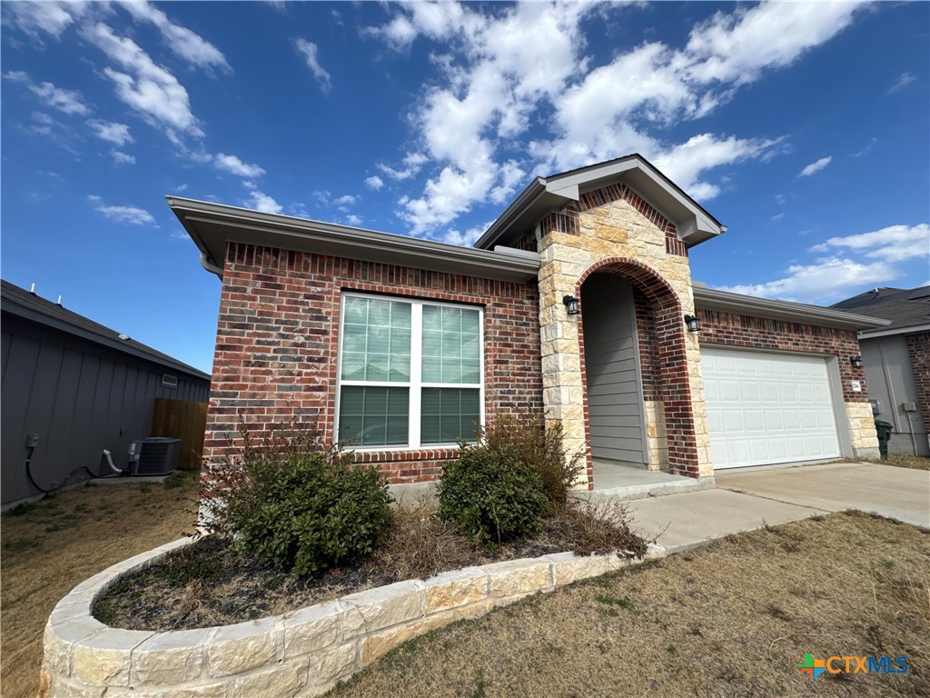 2214 Wasabi Road Temple, TX 76501 - Photo 2 of 26 a front view of a house with garden