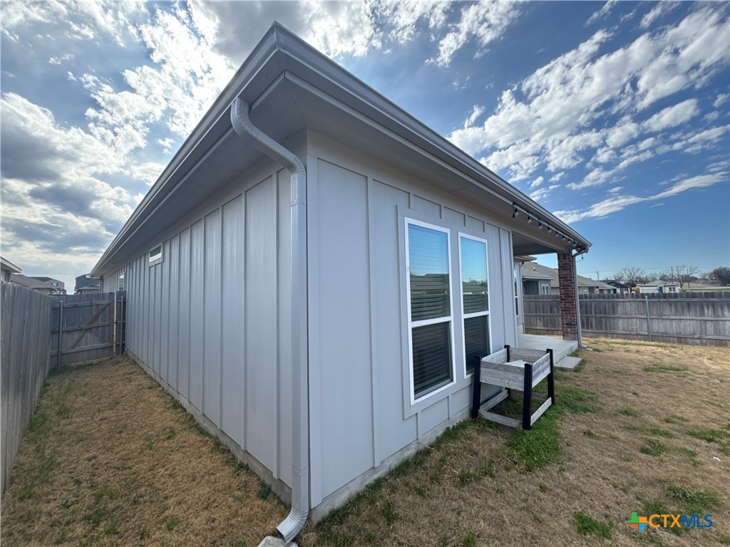 2214 Wasabi Road Temple, TX 76501 - Photo 26 of 26 a backyard of a house with outdoor seating and trees in the background