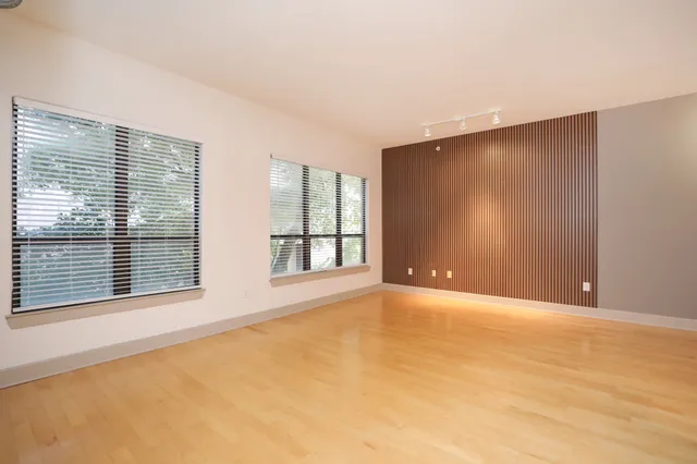 a view of a livingroom with wooden floor