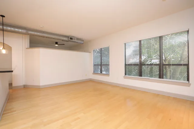 a view of a living room with furniture and a flat screen tv
