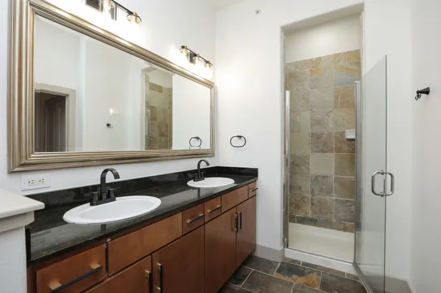 a view of a livingroom with furniture wooden floor and window