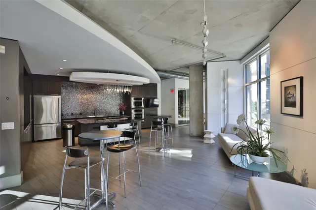 a view of a room with wooden floor and outdoor seating
