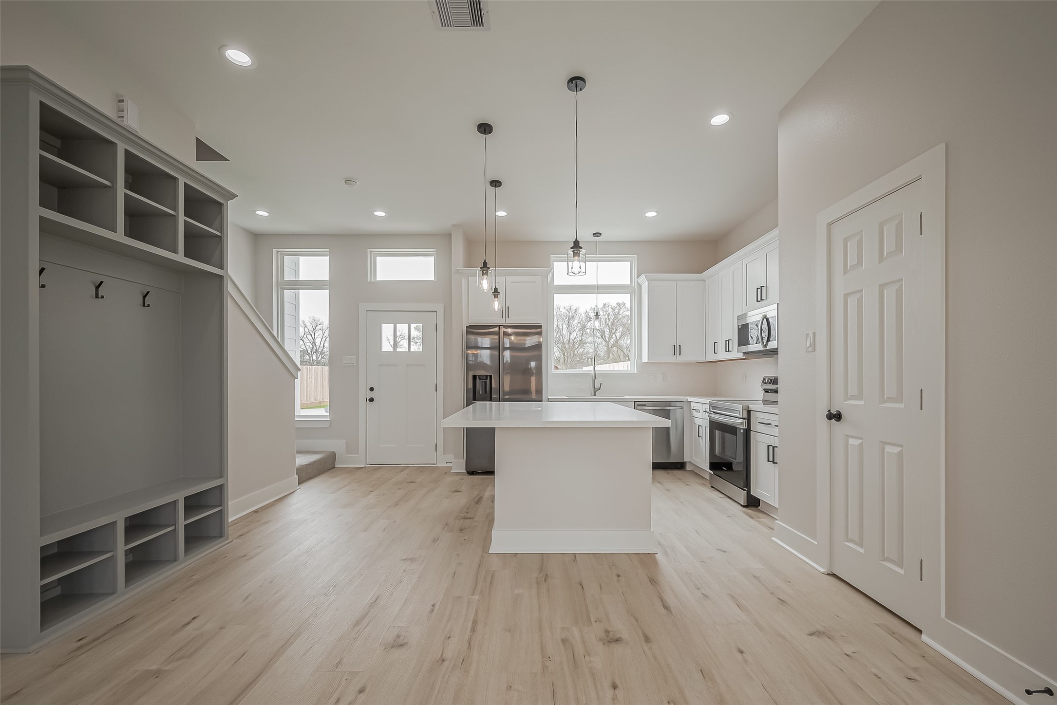 918 St Clair Street, Unit B Houston, TX 77088 - Photo 11 of 35 a view of kitchen with furniture and wooden floor