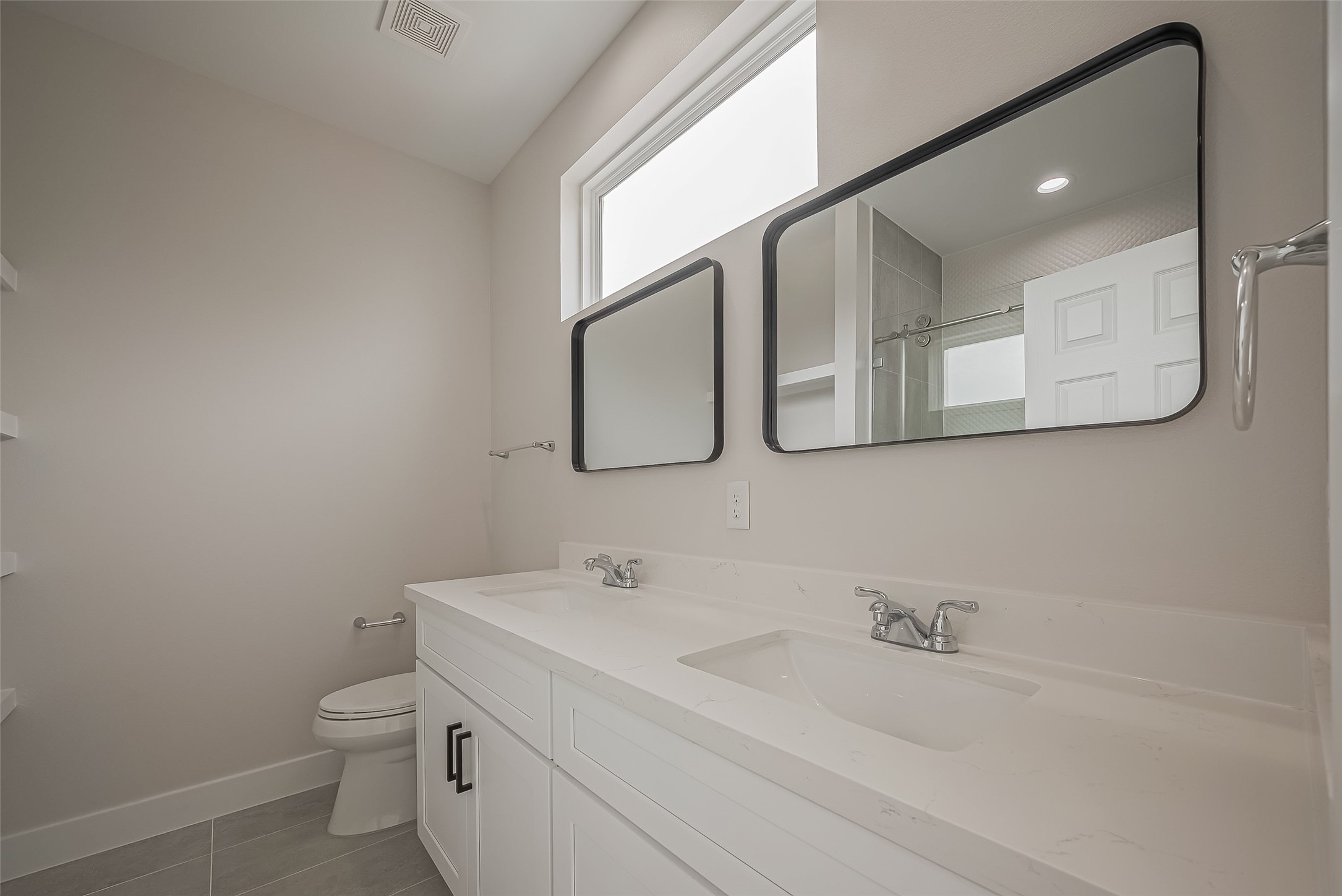 918 St Clair Street, Unit B Houston, TX 77088 - Photo 28 of 35 a bathroom with a toilet sink and mirror