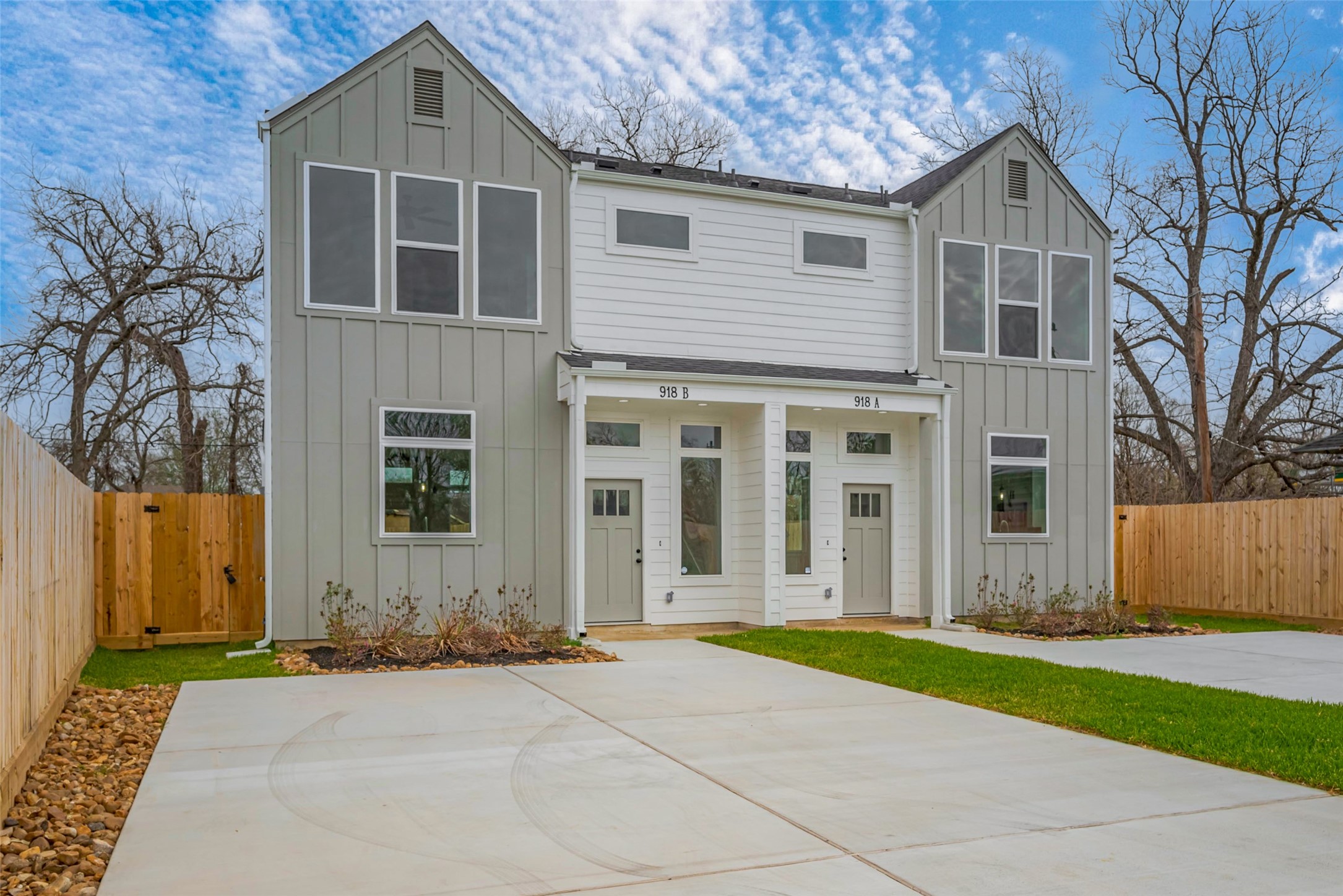 918 St Clair Street, Unit B Houston, TX 77088 - Photo 3 of 35 a front view of a house with a yard and garage