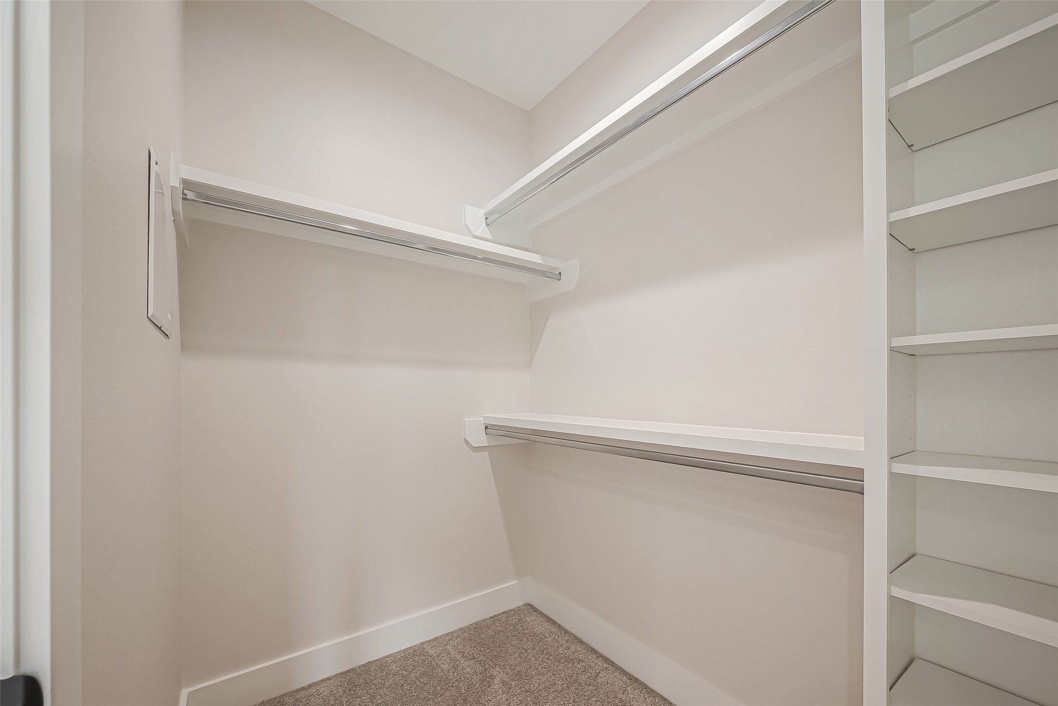 918 St Clair Street, Unit B Houston, TX 77088 - Photo 31 of 35 a view of walk in closet with empty racks