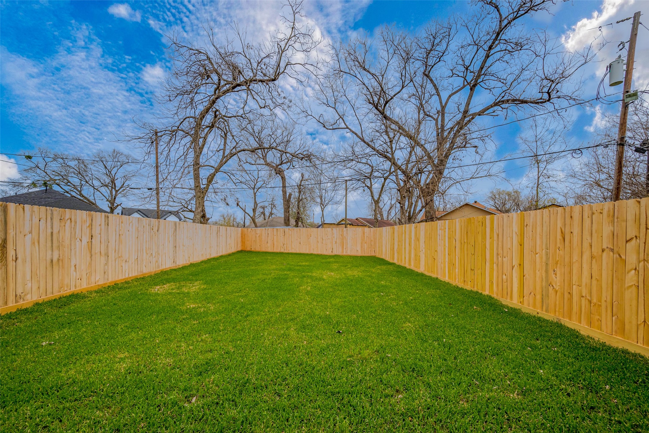 918 St Clair Street, Unit B Houston, TX 77088 - Photo 32 of 35 a view of backyard with wooden fence