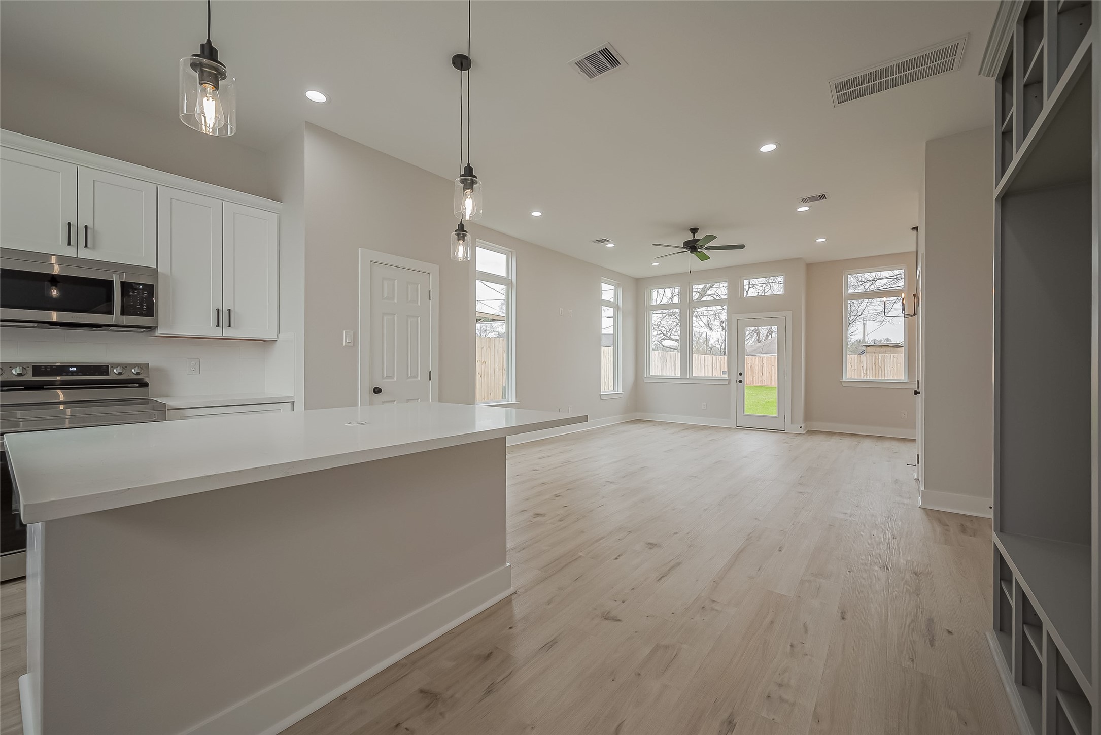 918 St Clair Street, Unit B Houston, TX 77088 - Photo 6 of 35 a view of a kitchen with kitchen island a sink stainless steel appliances and cabinets