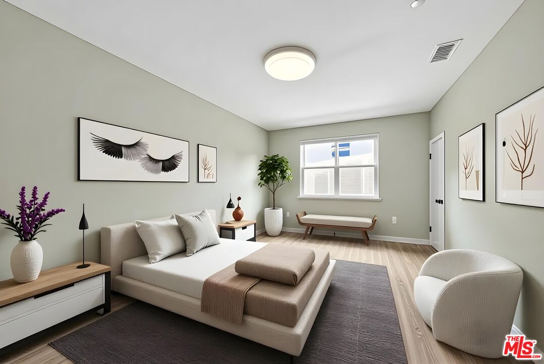 692 Colorado Circle Carson, CA 90745 - Photo 14 of 35 a bedroom with furniture and a large window