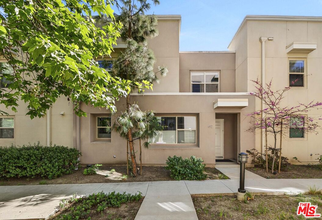 692 Colorado Circle Carson, CA 90745 - Photo 22 of 35 a front view of a house with garden