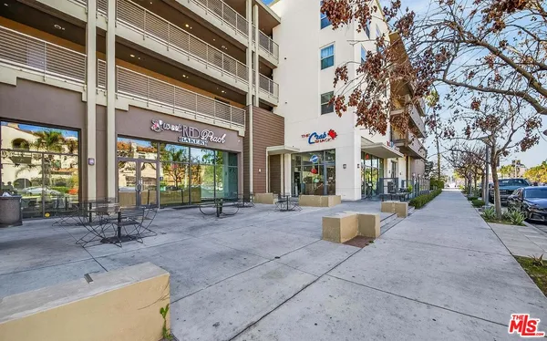 a view of a building with sitting area