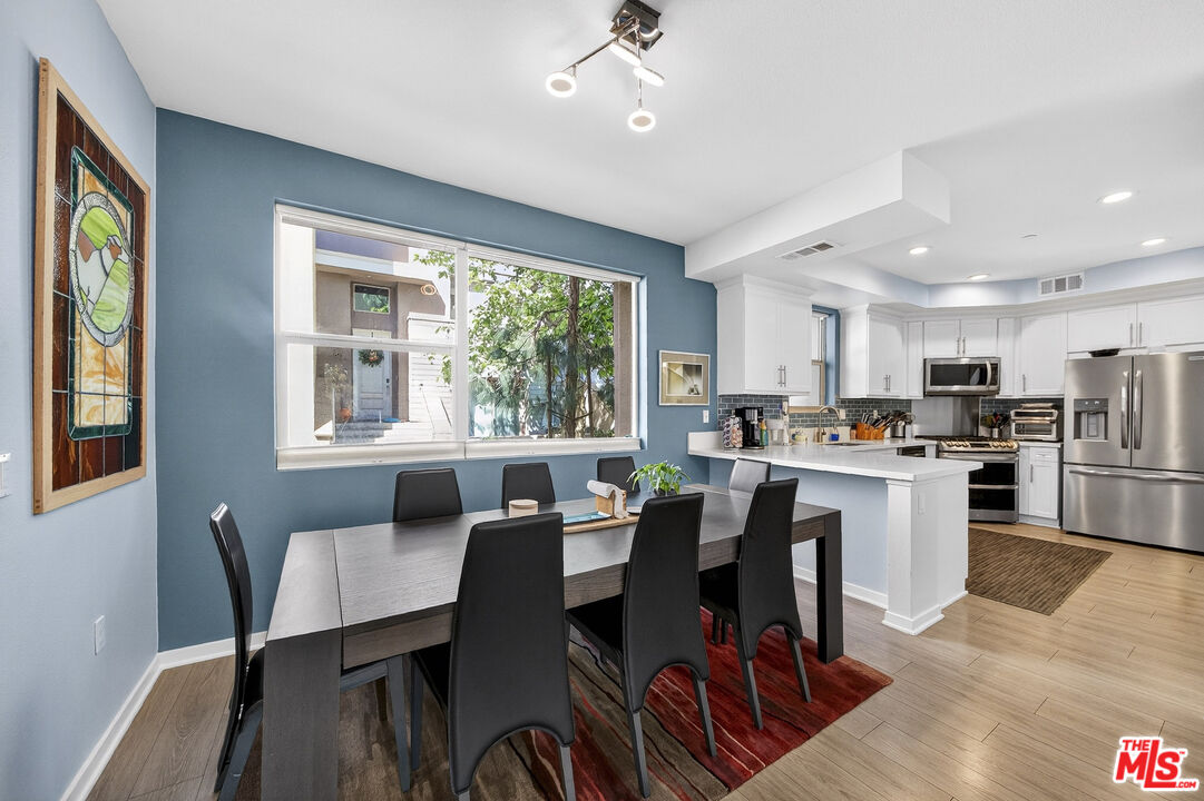 692 Colorado Circle Carson, CA 90745 - Photo 5 of 35 a open dining room with stainless steel appliances kitchen island granite countertop furniture and a kitchen view