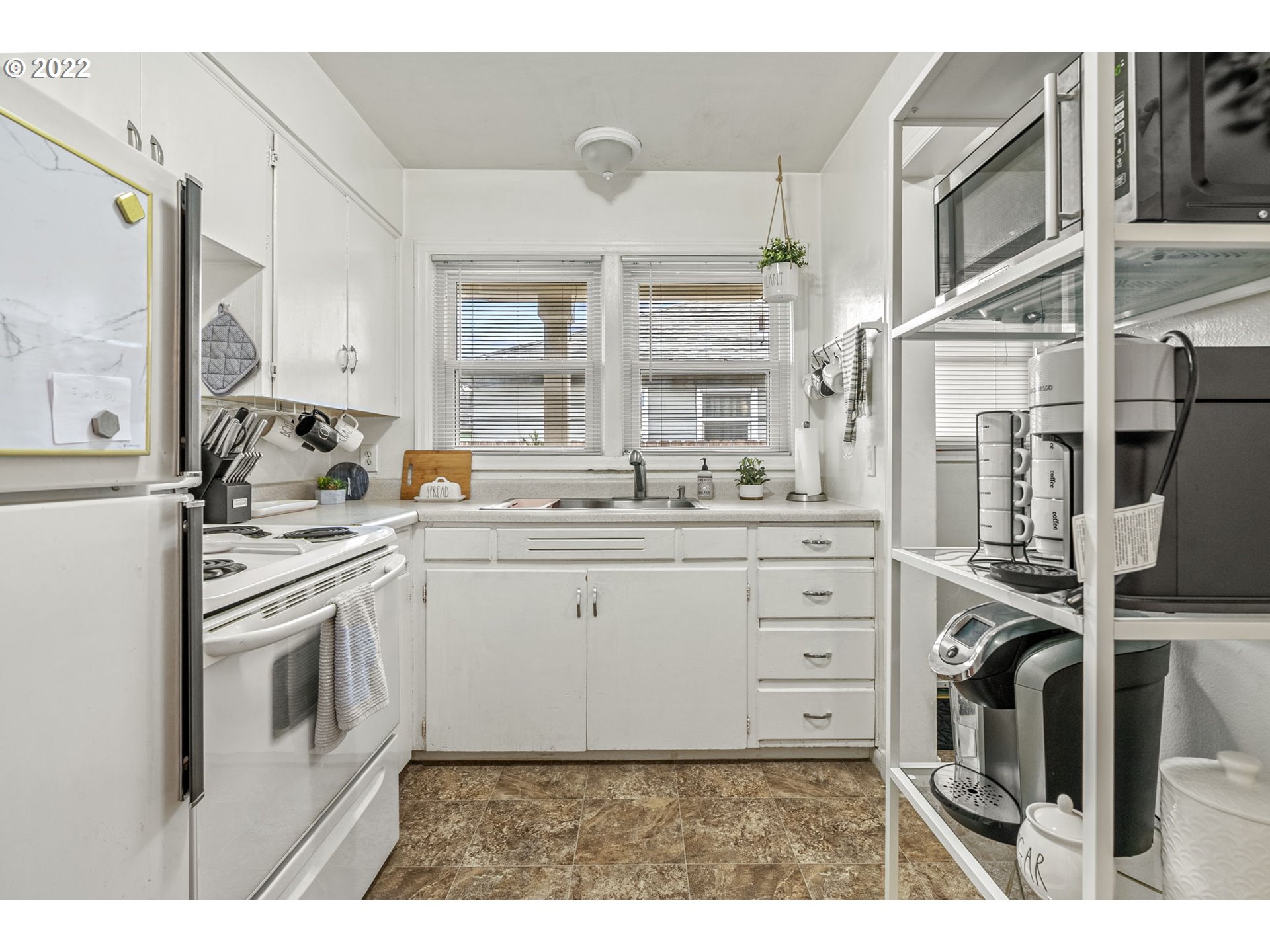 1057 17th Avenue Longview, WA 98632 - Photo 13 of 30 a kitchen with a stove oven and sink