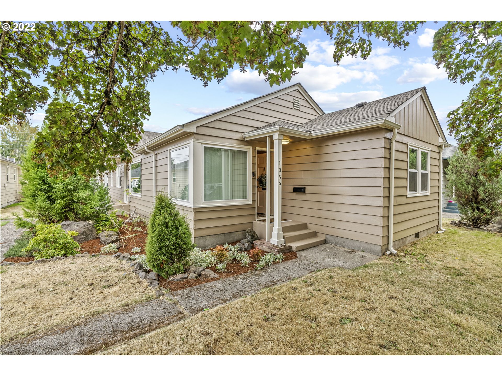 1057 17th Avenue Longview, WA 98632 - Photo 2 of 30 a view of a house with a yard