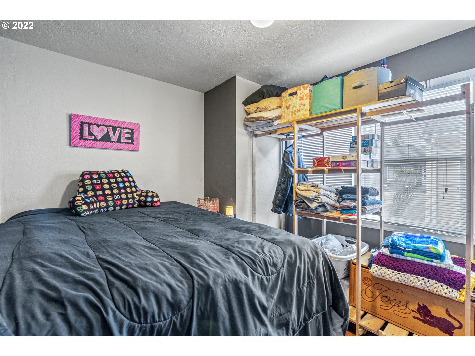 1057 17th Avenue Longview, WA 98632 - Photo 24 of 30 a bedroom with a bed and a window
