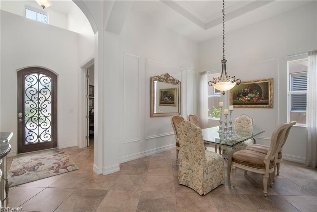 6476 Caldecott Drive Naples, FL 34113 - Photo 6 of 27 a dining room with furniture and window