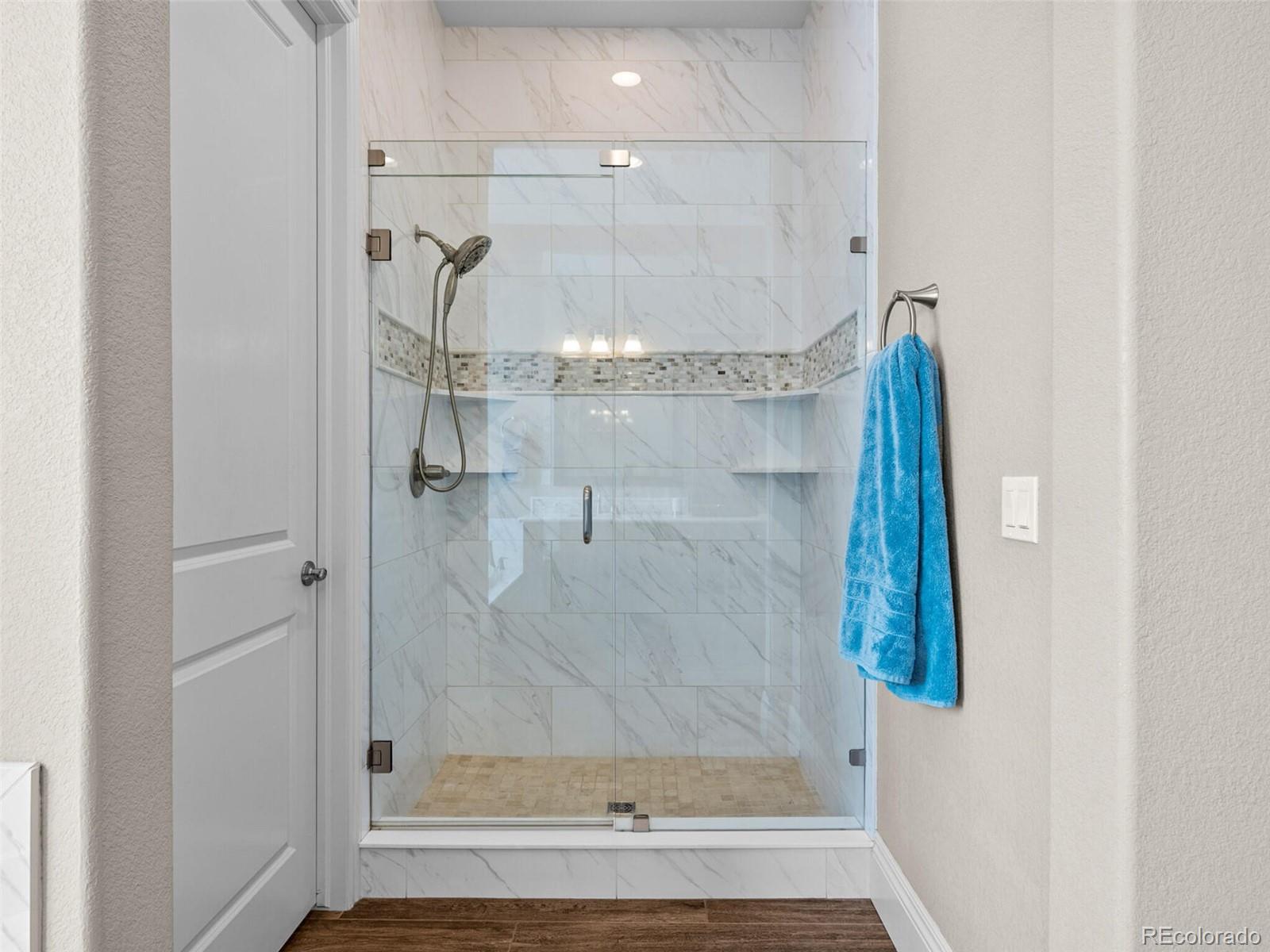 14945 Lyons Ridge Drive Morrison, CO 80465 - Photo 19 of 40 a bathroom with a shower