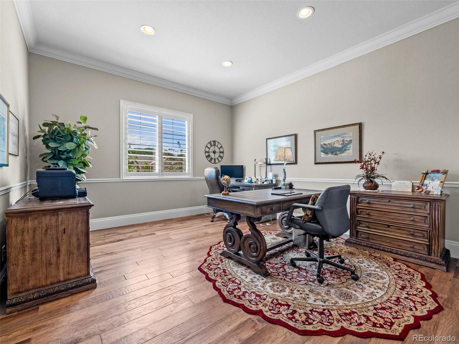 14945 Lyons Ridge Drive Morrison, CO 80465 - Photo 24 of 40 a workspace with furniture window and wooden floor