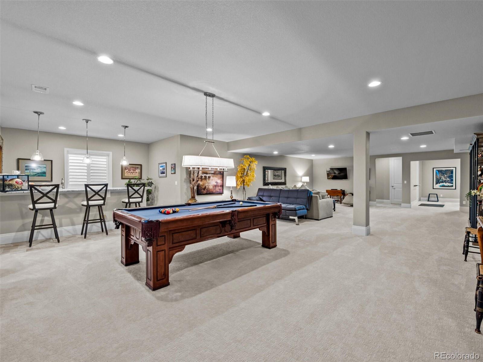 14945 Lyons Ridge Drive Morrison, CO 80465 - Photo 26 of 40 a room with lots of furniture