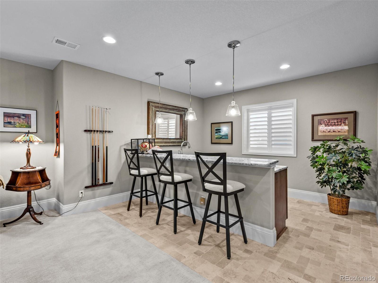 14945 Lyons Ridge Drive Morrison, CO 80465 - Photo 27 of 40 a view of a dining room with furniture