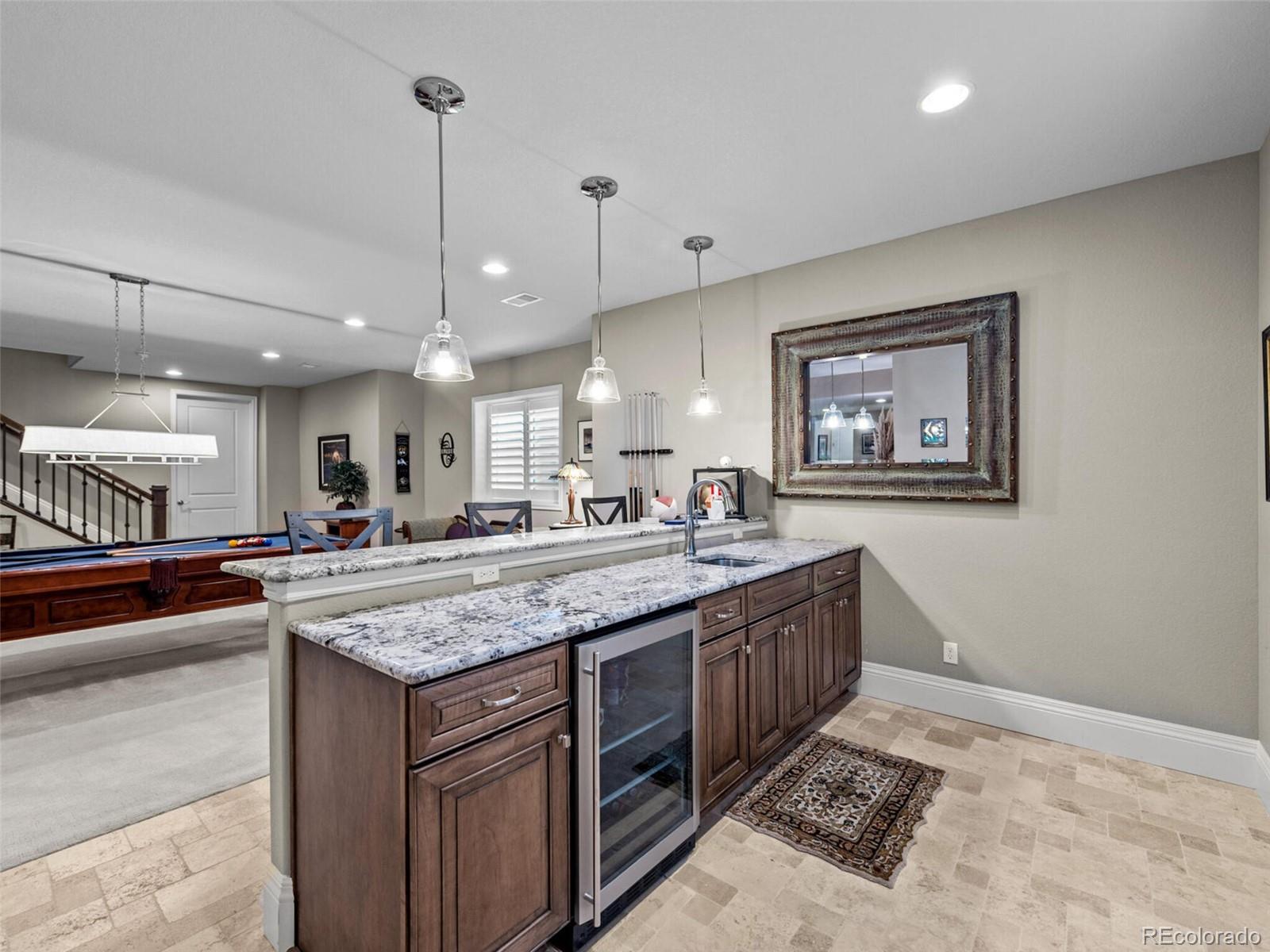 14945 Lyons Ridge Drive Morrison, CO 80465 - Photo 28 of 40 a kitchen with a stove and a sink