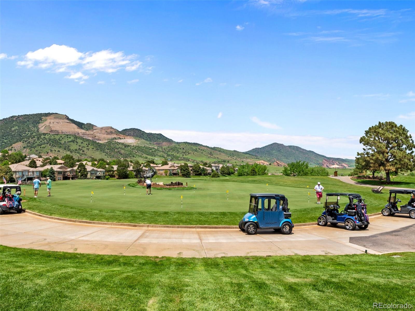 14945 Lyons Ridge Drive Morrison, CO 80465 - Photo 38 of 40 a view of a house with a yard and a garden