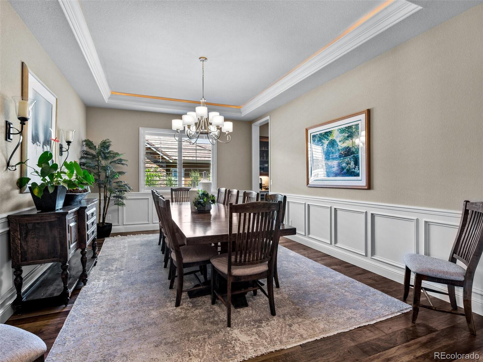 14945 Lyons Ridge Drive Morrison, CO 80465 - Photo 5 of 40 a view of a dining room with furniture window and wooden floor