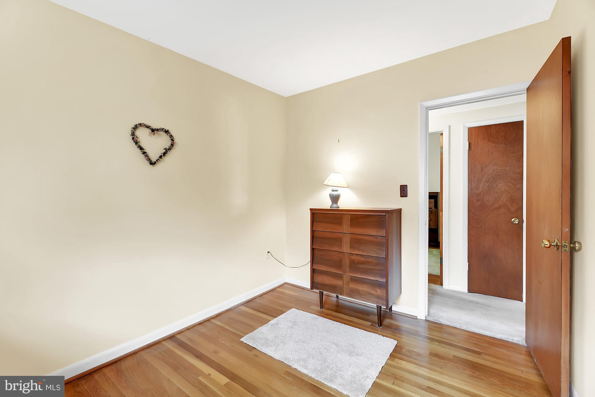 6827 Queens Ferry Road Baltimore, MD 21239 - Photo 13 of 29 Bedroom three, wood fkloors