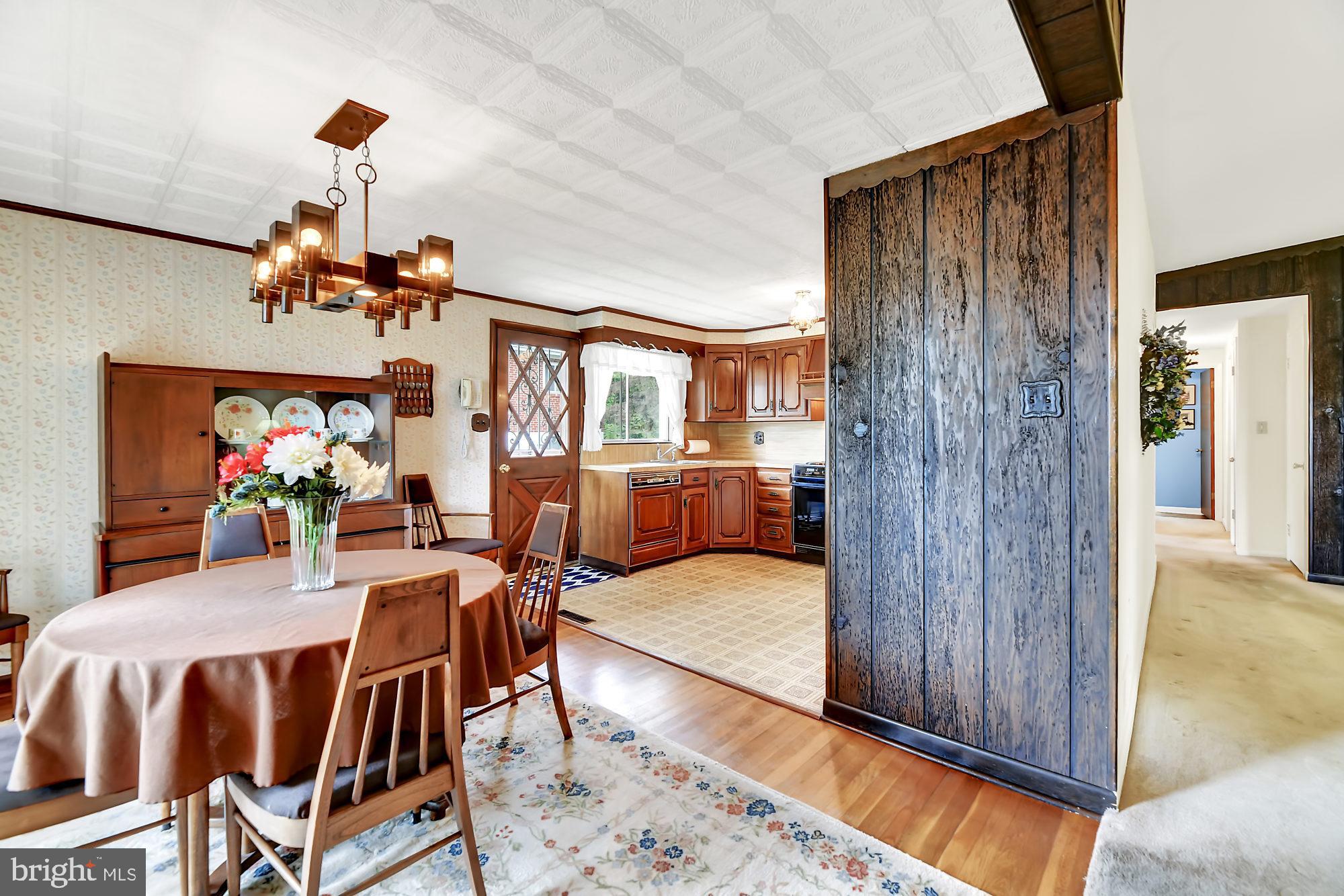 6827 Queens Ferry Road Baltimore, MD 21239 - Photo 7 of 29 Dining area w/wood floors open to kitchen