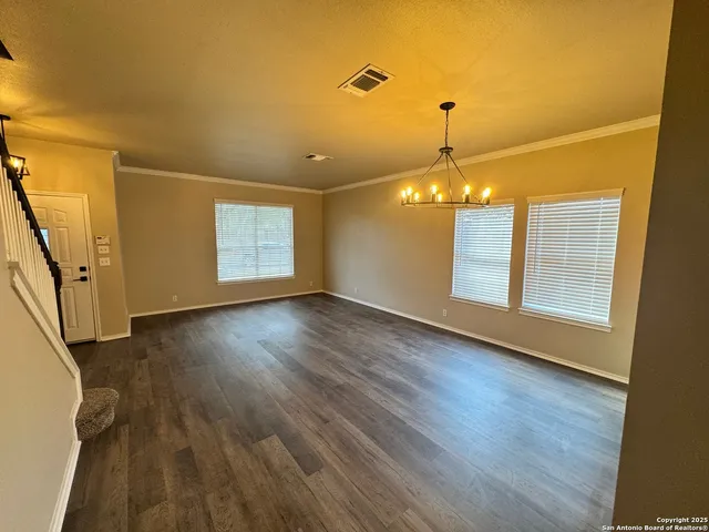 wooden floor in an empty room with a fireplace