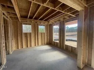 a view of a hallway with a door and stairs