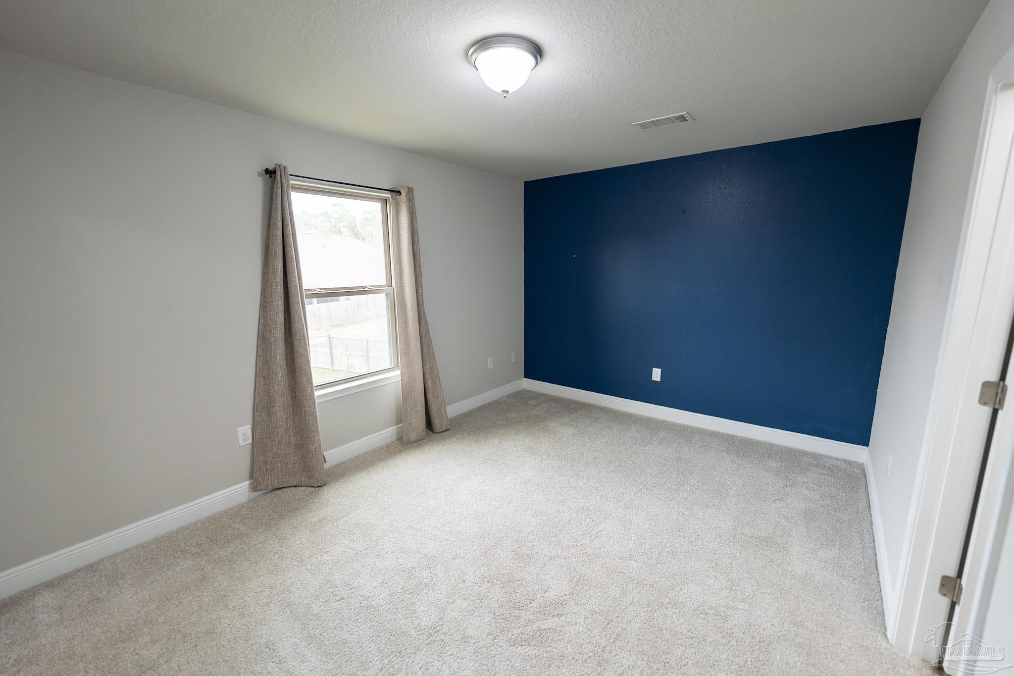 1060 Bretts Way Cantonment, FL 32533 - Photo 22 of 32 an empty room with windows