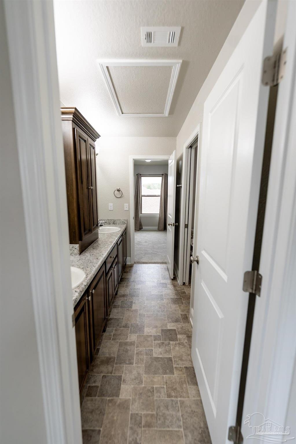 1060 Bretts Way Cantonment, FL 32533 - Photo 26 of 32 a hallway with windows