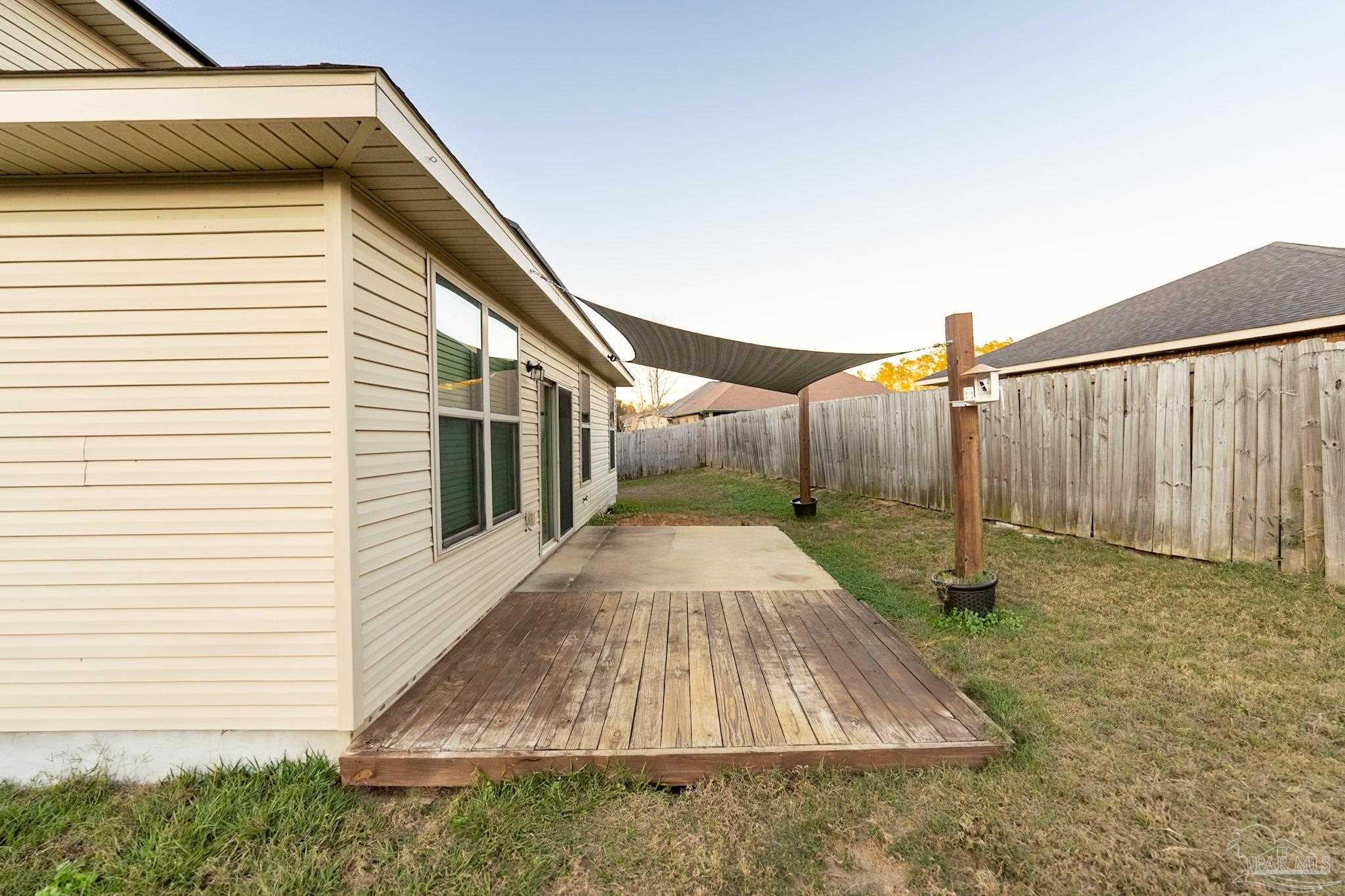 1060 Bretts Way Cantonment, FL 32533 - Photo 29 of 32 a bathroom with a sink and mirror