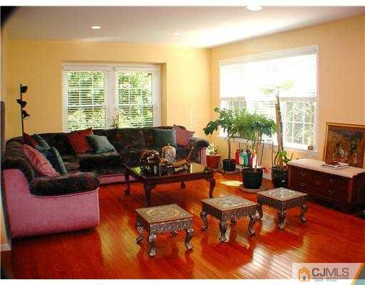 3901 Springbrook Drive Edison, NJ 08820 - Photo 3 of 10 a living room with furniture and a large window