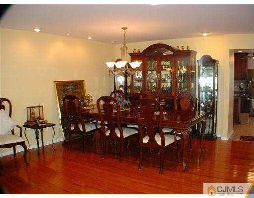 3901 Springbrook Drive Edison, NJ 08820 - Photo 4 of 10 a view of a dining room with furniture and wooden floor