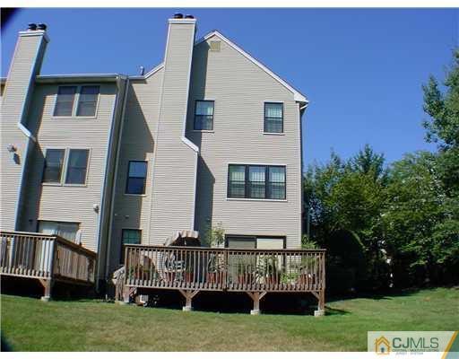 3901 Springbrook Drive Edison, NJ 08820 - Photo 10 of 10 a front view of a house with a garden