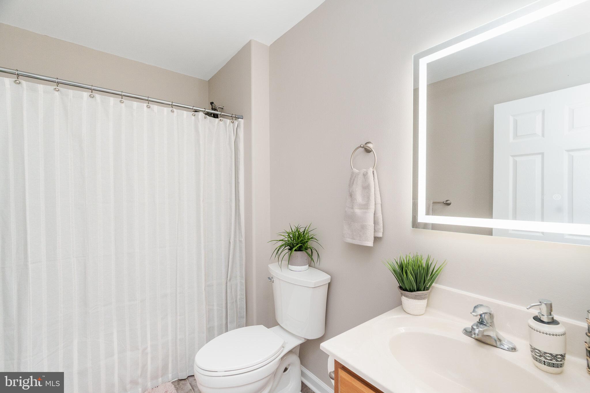 112 Ben Boulevard Elkton, MD 21921 - Photo 14 of 22 a bathroom with a sink a toilet and a mirror