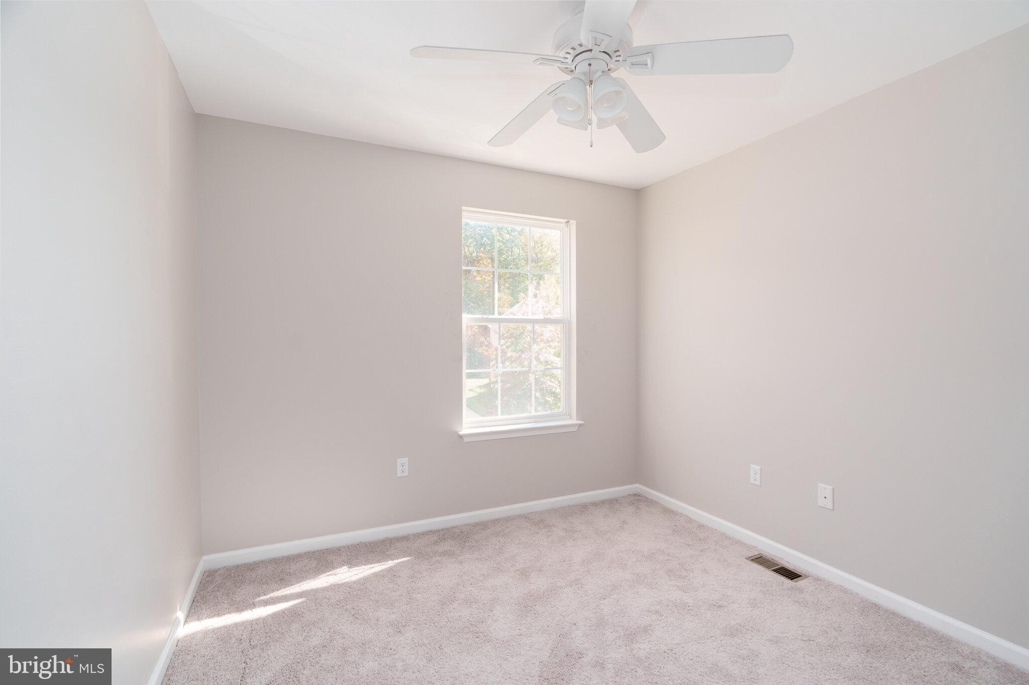 112 Ben Boulevard Elkton, MD 21921 - Photo 16 of 22 an empty room with a window and a fan