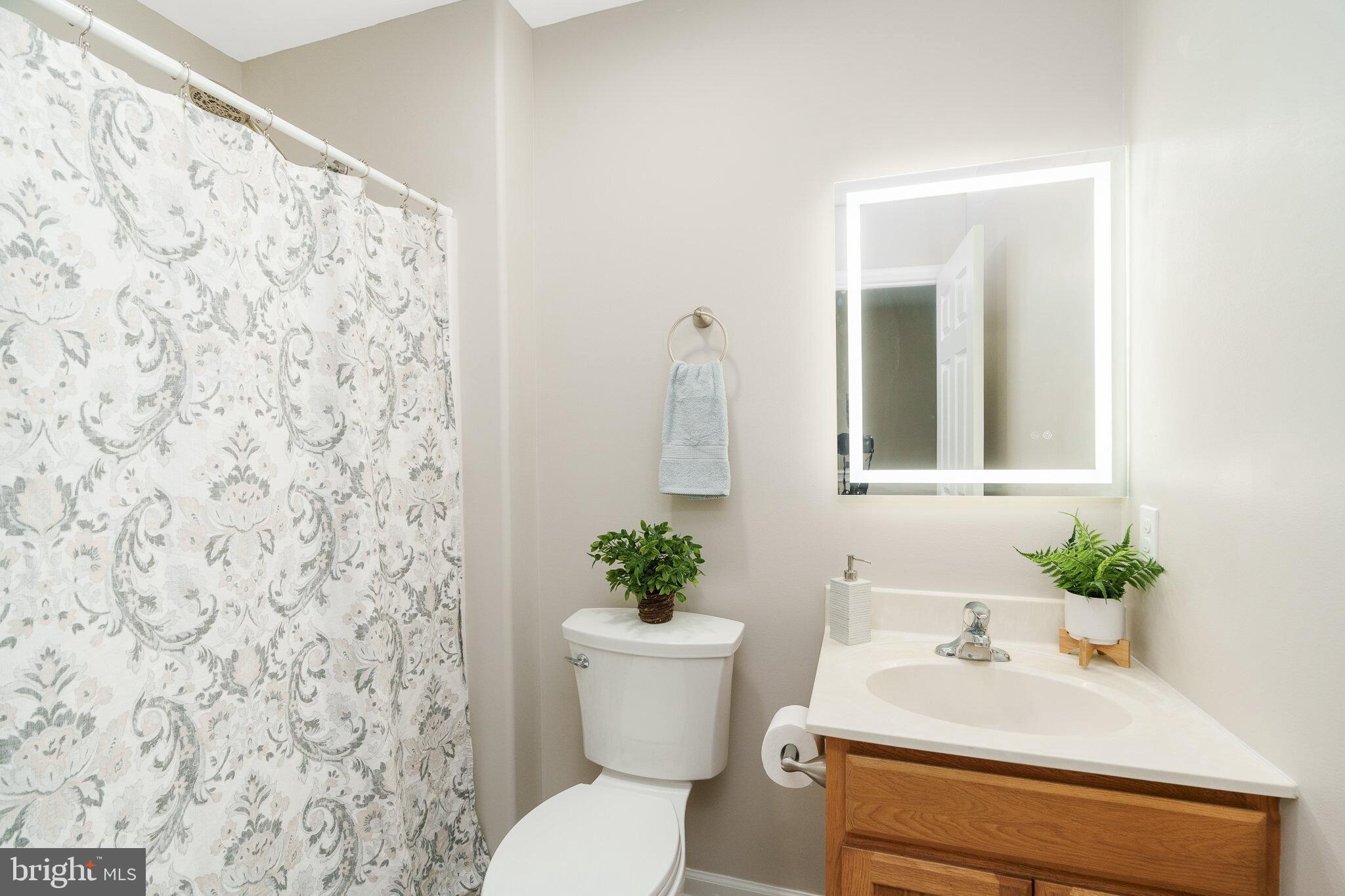 112 Ben Boulevard Elkton, MD 21921 - Photo 17 of 22 a bathroom with a sink and a mirror