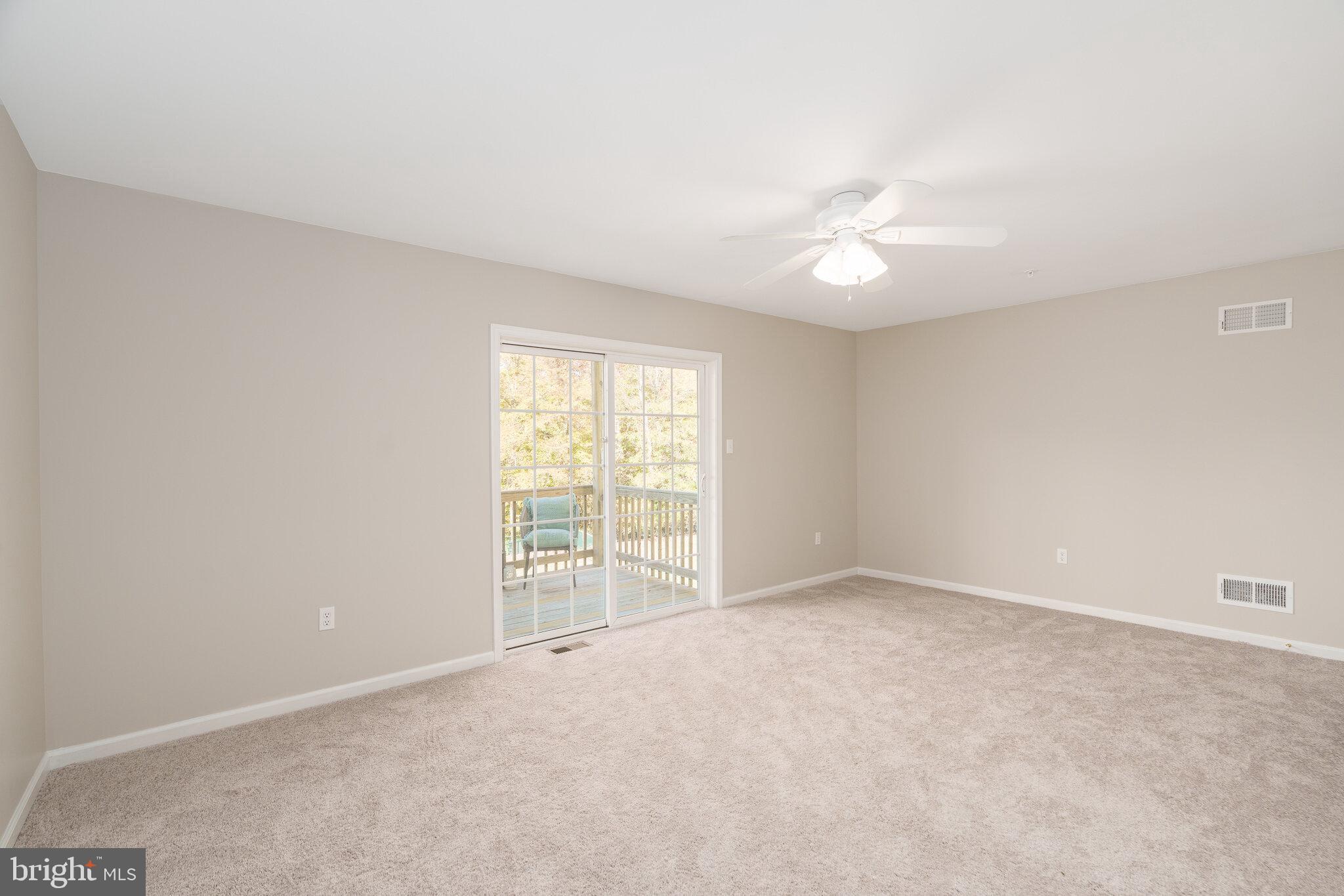 112 Ben Boulevard Elkton, MD 21921 - Photo 3 of 22 an empty room with windows and ceiling fan