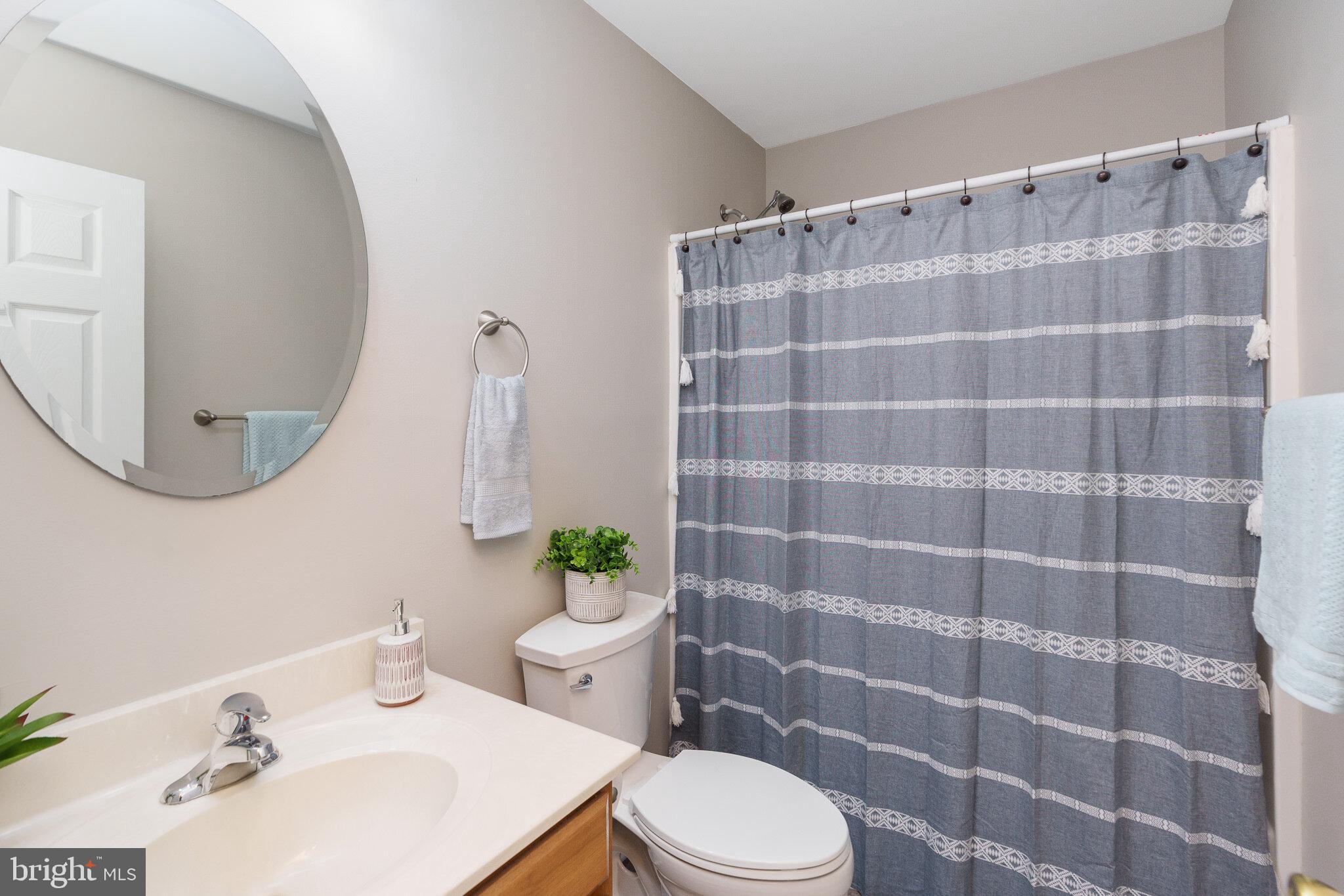 112 Ben Boulevard Elkton, MD 21921 - Photo 4 of 22 a bathroom with a sink a toilet and a mirror